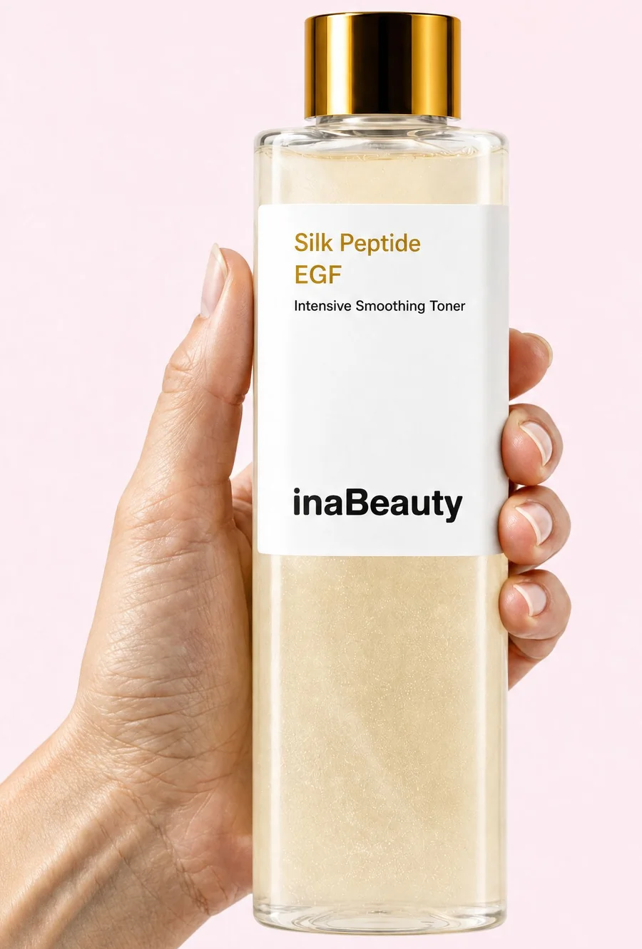 Hand holding a bottle of Inatone Silk Peptide EGF toner